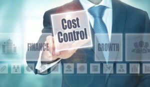 A Businessman Selecting A Cost Control Concept Button